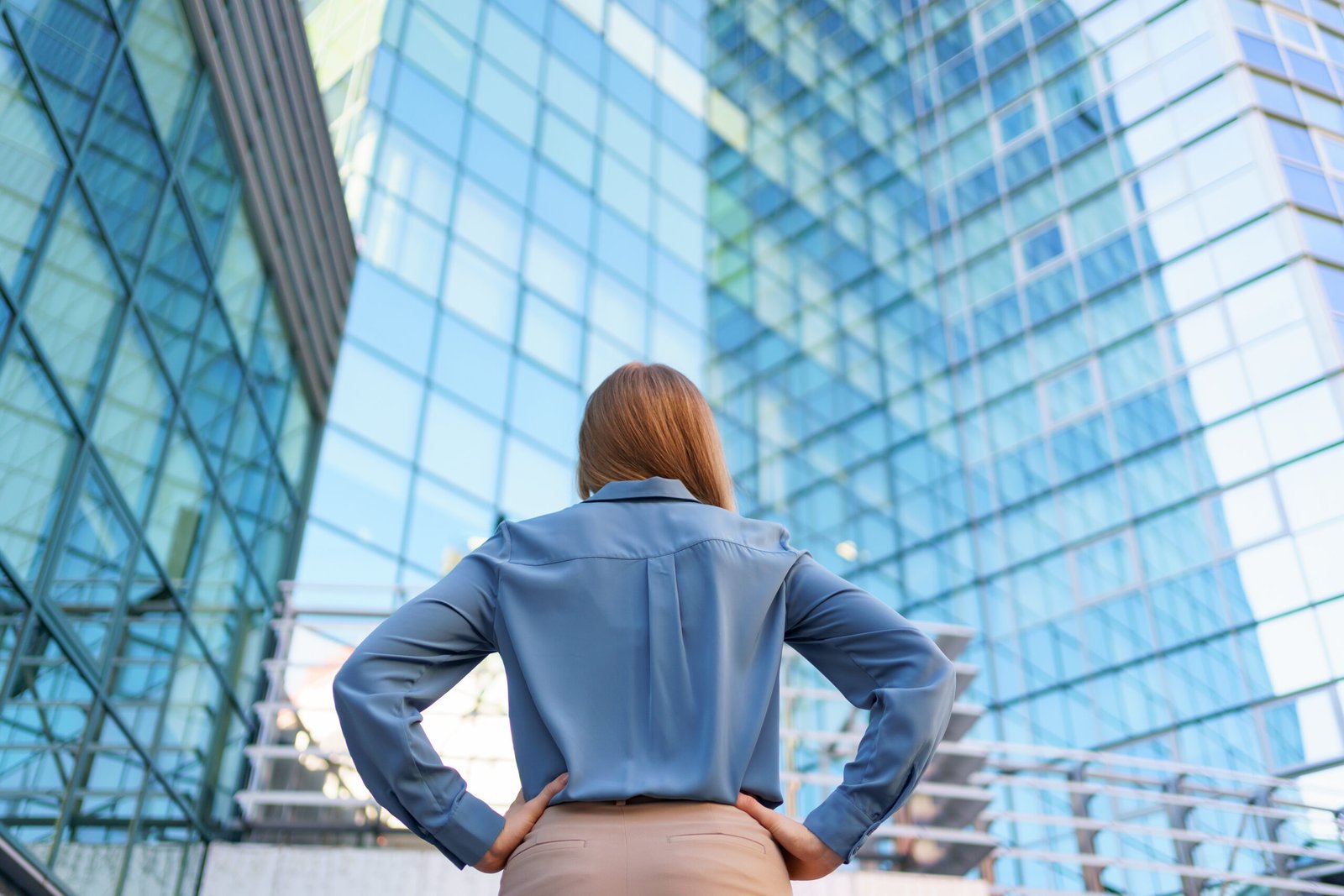 Back view woman looking business building